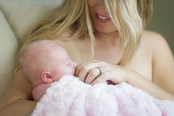 Image showing Young Beautiful Mother Holding Her Precious Newborn Baby Girl