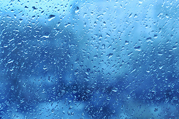 Image showing Natural water drops on window glass