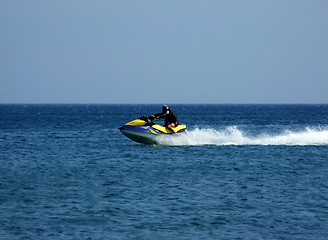 Image showing The men goes for a drive on a wave runner on sea waves 1