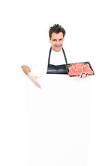 Image showing Butcher with advertising sign