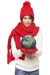 Image showing Winter woman with globe