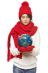 Image showing Winter woman with globe