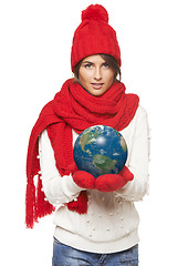 Image showing Winter woman with globe