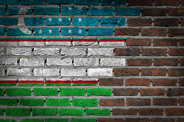 Image showing Brick wall texture with flag