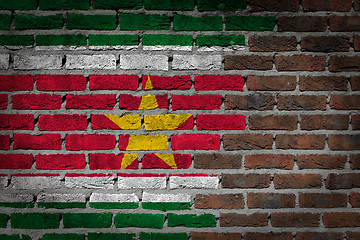 Image showing Brick wall texture with flag