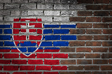 Image showing Brick wall texture with flag