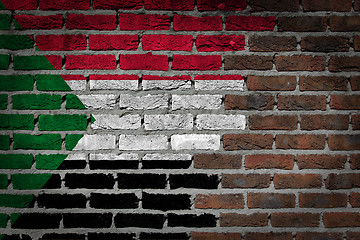 Image showing Brick wall texture with flag