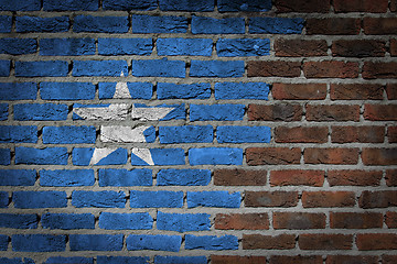 Image showing Brick wall texture with flag