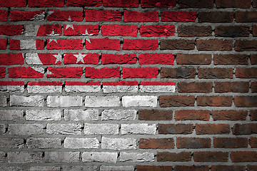 Image showing Brick wall texture with flag