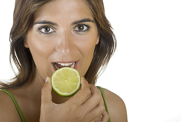 Image showing Eating a lime