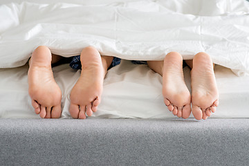 Image showing Sweet Couples Feet Soles on Bed