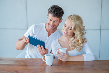 Image showing Happy couple surfing the web on a tablet