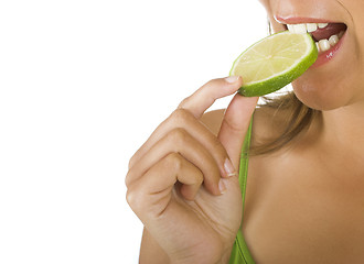 Image showing Eating a lime