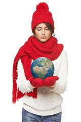 Image showing Winter woman with globe