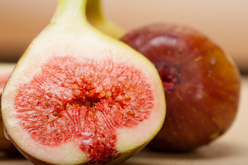 Image showing fresh figs on a rustic table