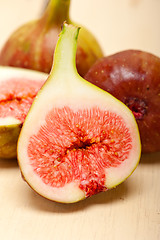 Image showing fresh figs on a rustic table