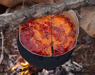 Image showing Cooking borscht (Ukrainian traditional soup) on campfire