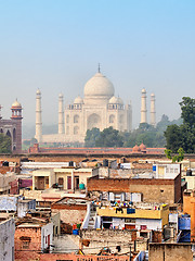 Image showing Poor neighborhoods and luxurious Taj Mahal. Agra, India