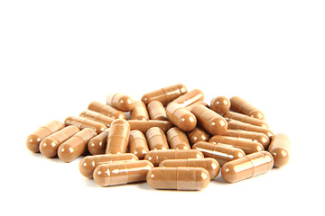 Image showing brown pills isolated