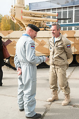 Image showing Representatives of Uralvagonzavod plant near tank