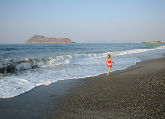 Image showing Girl running on the beach