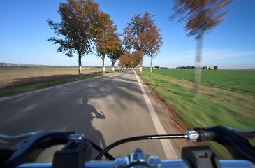 Image showing Riding a bicycle