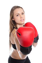 Image showing Young blonde demonstrating boxing gloves.