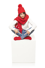 Image showing Winter woman sitting on blank billboard placard sign