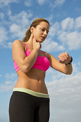 Image showing Athlete checking her pulse