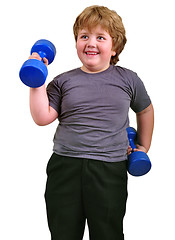 Image showing isolated portrait of smiling kid exercising with dumbbells 