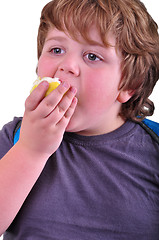 Image showing closeup portrait of kid eating an apple