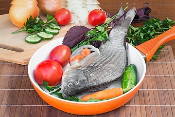 Image showing Fish and components for her preparation: vegetables, spices, par