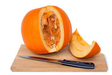 Image showing Ripe cut the pumpkin on a white background. 