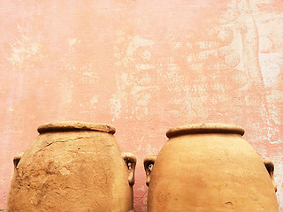 Image showing Clay amphoras near an old wall