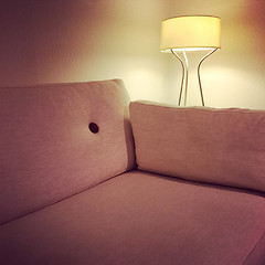 Image showing Comfortable fabric sofa and cozy lamp