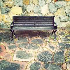 Image showing Wooden bench on colorful tile background