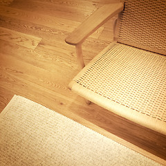 Image showing Rattan chair on wooden floor