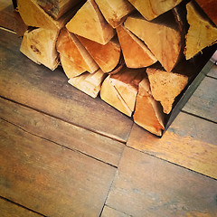 Image showing Firewood on old rustic floor