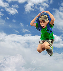 Image showing worried or scared schoolchild with backpack against sky