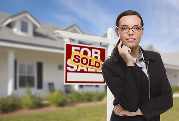 Image showing Mixed Race Woman in Front of House and Sold Sign