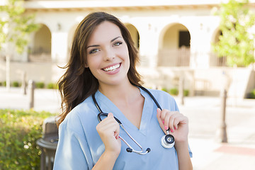 Image showing Proud Young Adult Woman Doctor or Nurse Portrait Outside