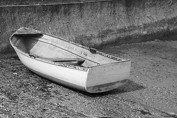 Image showing Weather-beaten dinghy on a concrete slipway