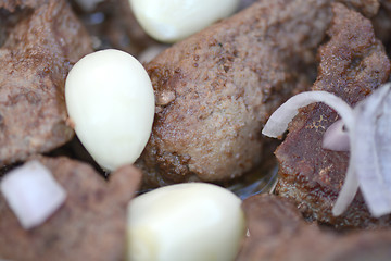 Image showing macro food, garlic on fried liver