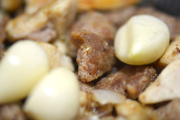 Image showing macro food, garlic on fried liver