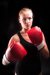 Image showing Beautiful girl defends in boxing gloves