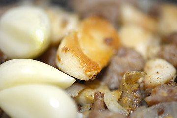 Image showing macro food, garlic on fried liver