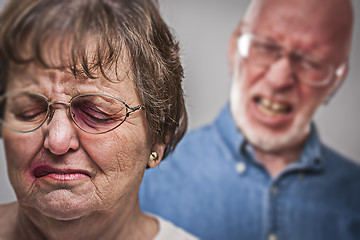 Image showing Battered and Scared Woman with Ominous Man Behind