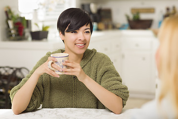 Image showing Mixed Race Young Attractive Woman Socializing with Friend