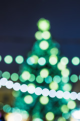 Image showing Decorated Christmas tree. Abstract blurred lights background