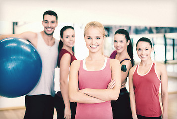 Image showing woman standing in front of the group in gym